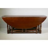 A large oak gateleg wake table, 200 x 152cm, 76cm high