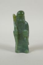 A Chinese carved green jade Shou Lao figure, 11cm high