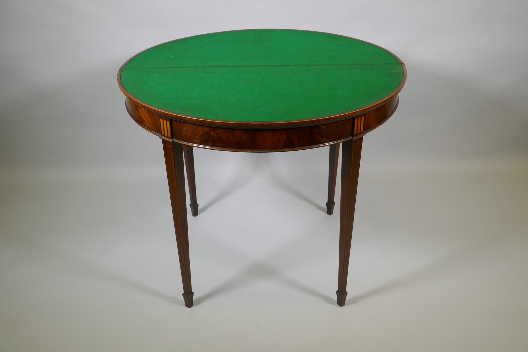 A Georgian mahogany demi lune card table, fiddle back mahogany with satinwood inlaid fan and - Image 4 of 4
