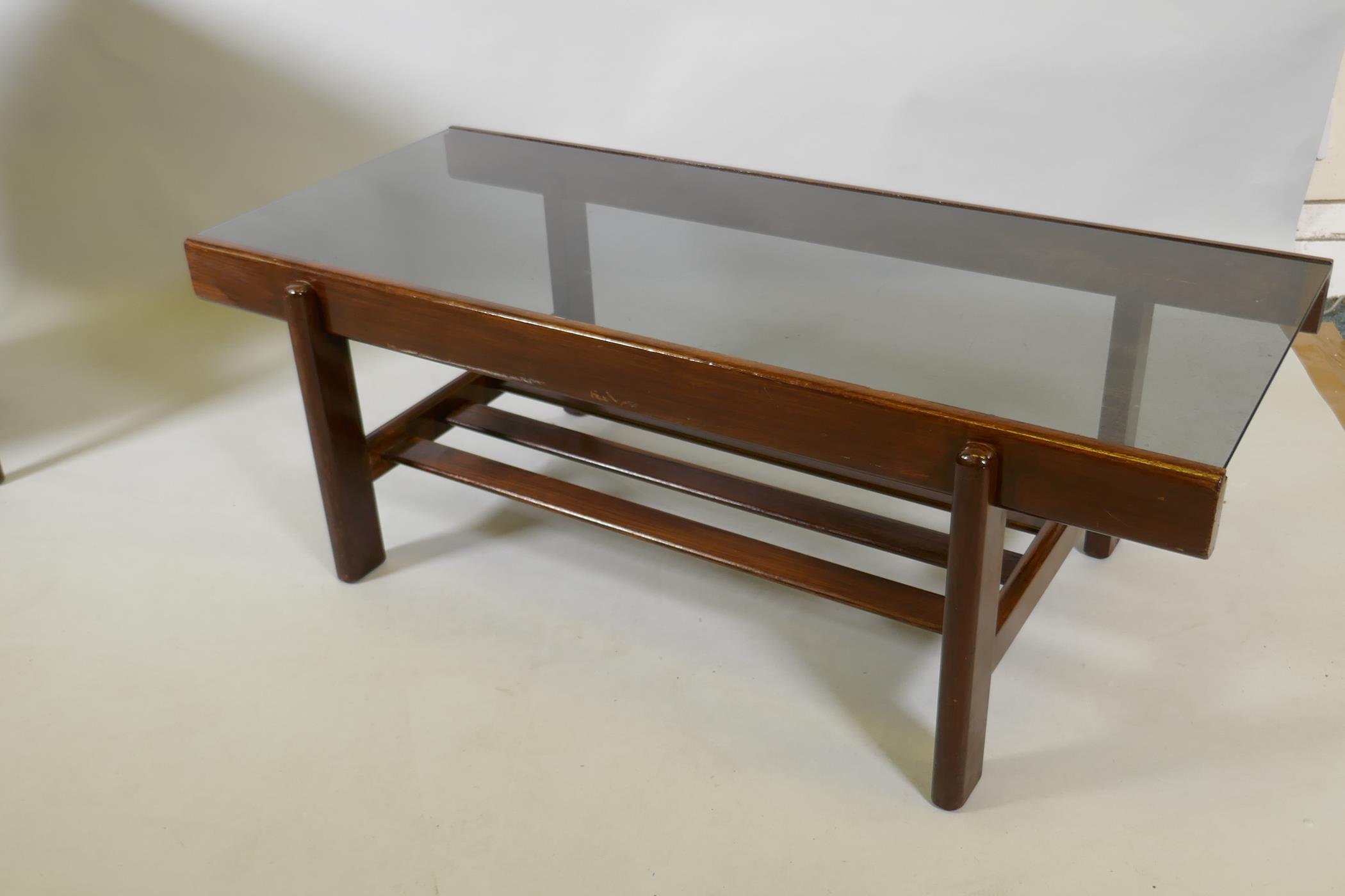A mid century sapele wood two tier coffee table with tinted glass top, 100 x 44 x 36cm, and single - Image 2 of 4
