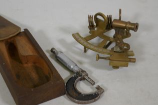 A brass sextant and engineers gauge by Moore and Wright, 14cm long