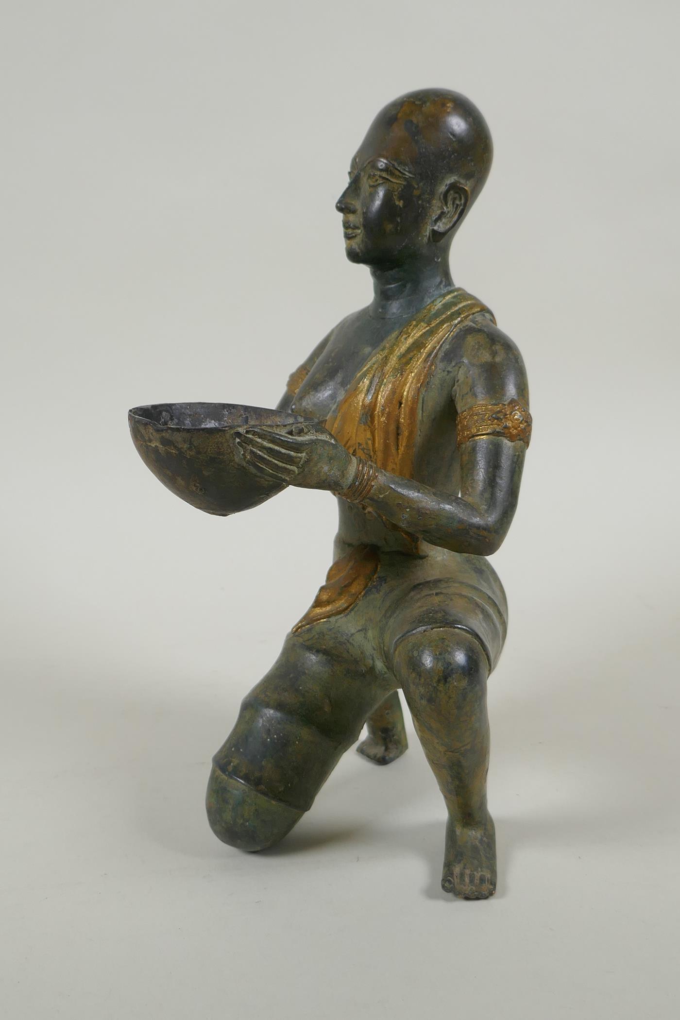 An antique oriental filled bronze figure of a kneeling woman carrying a bowl, 24cm high - Image 4 of 4