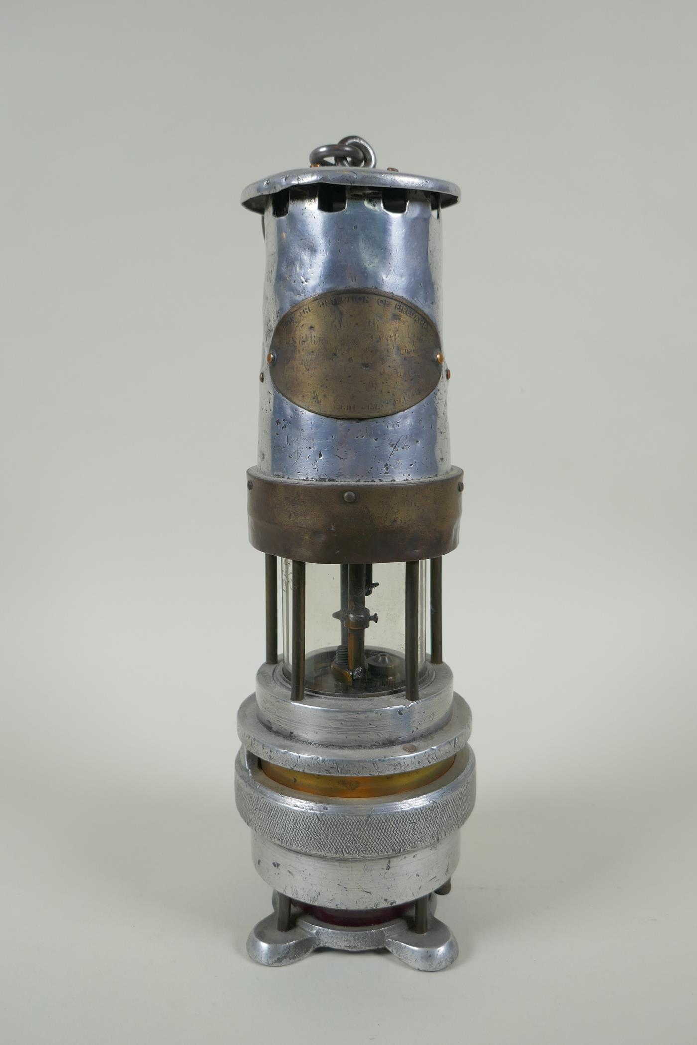 A Spiralarm Type M brass and polished metal automatic gas detector miners lamp by J. H. Naylor