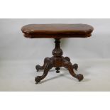 A Victorian burr walnut shaped top card table, raised on a carved and turned column and cabriole