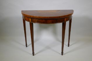 A Georgian mahogany demi lune card table, fiddle back mahogany with satinwood inlaid fan and