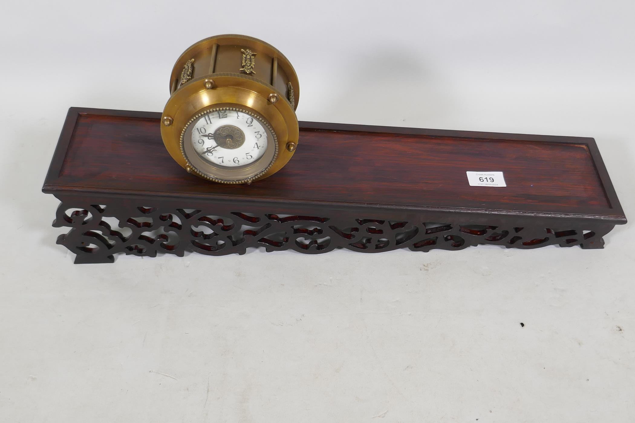 A brass cased gravity driven incline rolling clock with enamel dial and Arabic numerals, standing on - Image 3 of 3