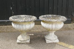 A pair of painted reconstituted stone planters, 45cm high x 46cm diameter