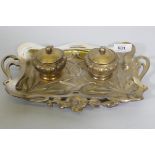 An Art Nouveau silver plated desk stand, the two inkwells with ruby glass liners, 29 x 19cm