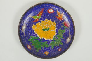 A Chinese blue ground cloisonne dish decorated with birds and flowers, engraved bat and auspicious