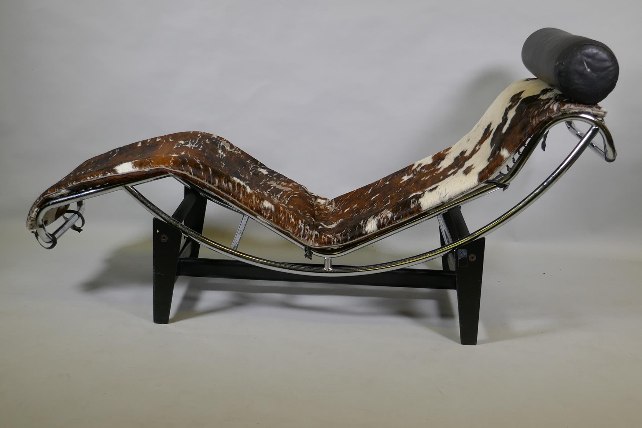 After Corbusier, a Cassina type LC4 chaise longue, upholstered in pony hide on a chrome frame and