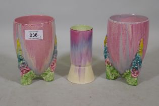 A pair of Clarice Cliff Wilkinsons My Garden pattern vase, and a Newport vase, 15cm high