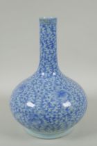 A C19th Chinese blue and white porcelain bottle vase with scrolling floral decoration, AF repair,