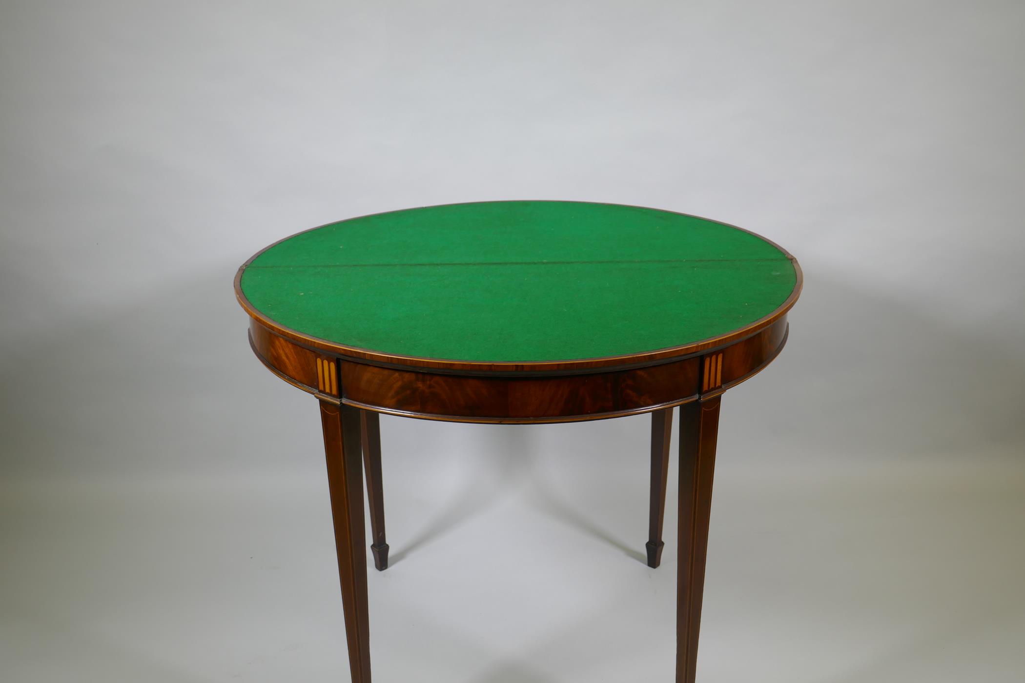 A Georgian mahogany demi lune card table, fiddle back mahogany with satinwood inlaid fan and - Image 3 of 4
