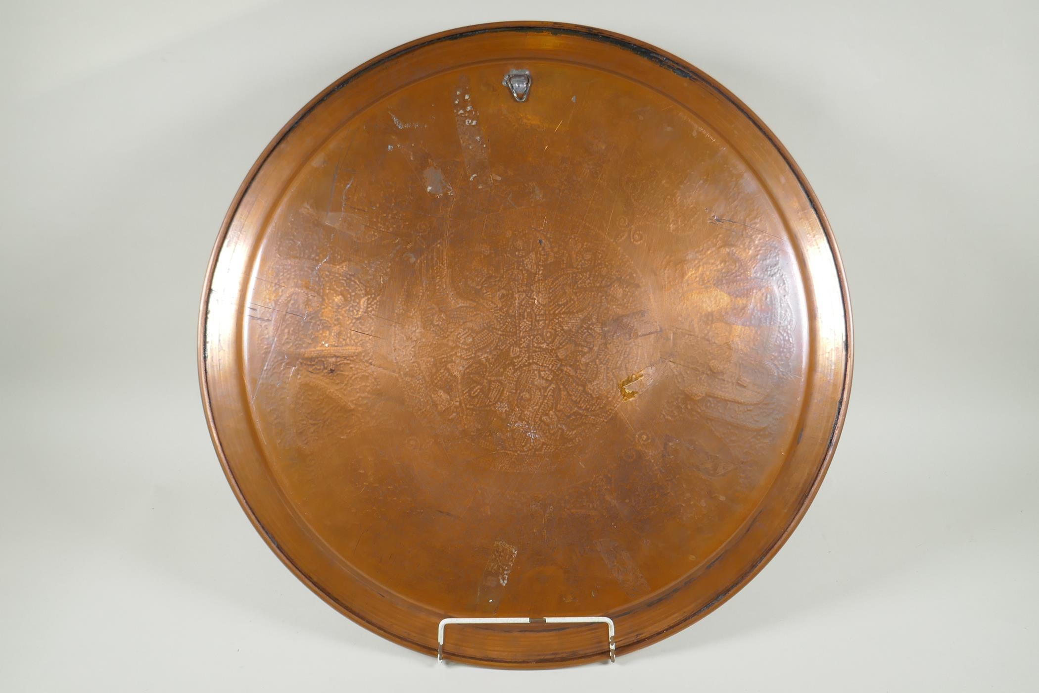 An Islamic silver overlaid copper tray with caligraphic script decoration, 55cm diameter - Image 4 of 4