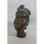 An African Benin bronze head, 24cm high