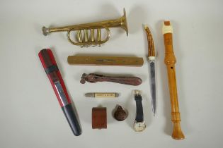 A quantity of objects of virtue to include a miniature trumpet, boat level, letter openers,
