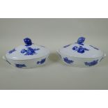 A pair of Royal Copenhagen blue and white porcelain tureens with floral decoration and lemon