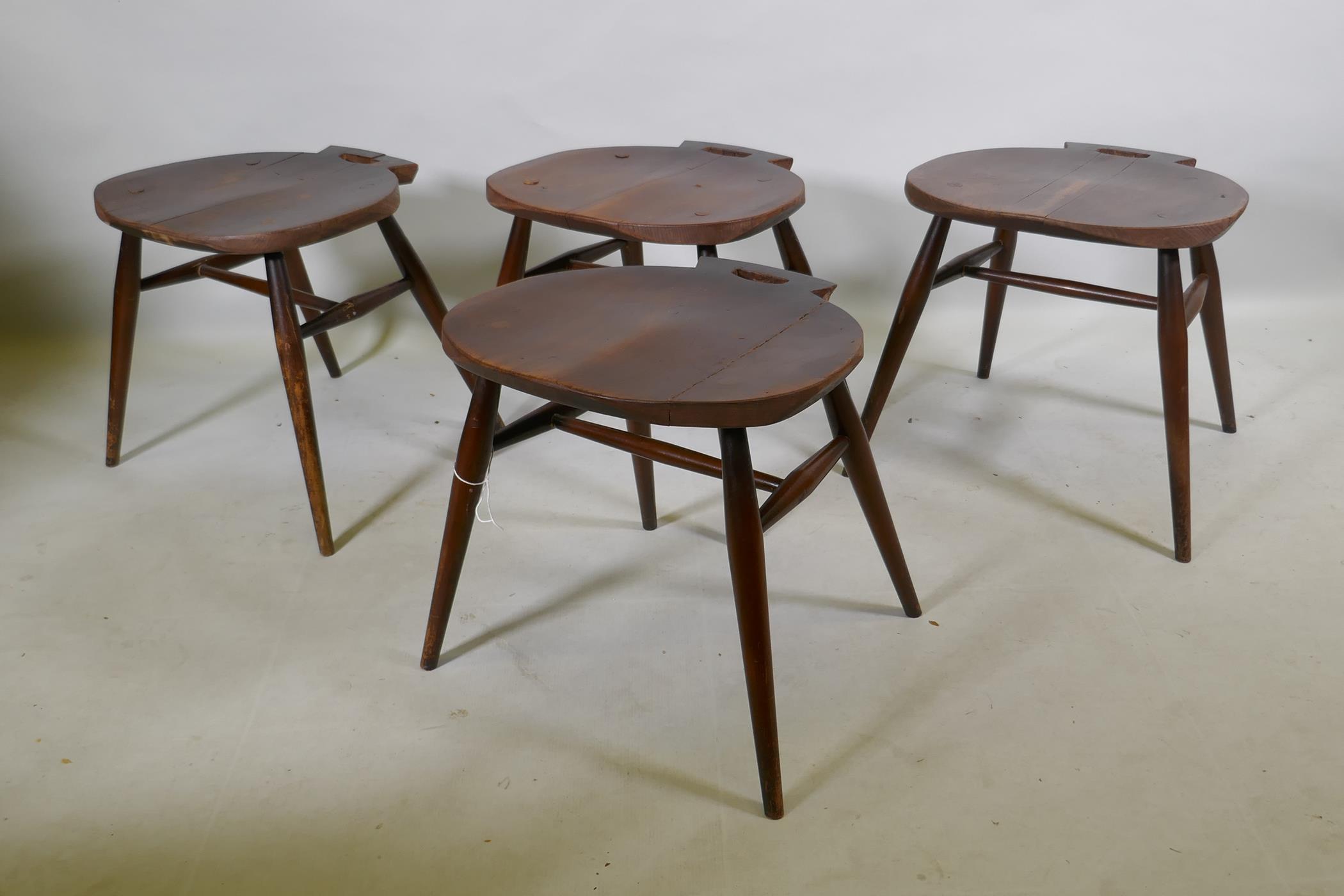 Four mid century stained Ercol adapted stools
