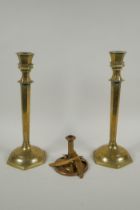 A studio art coper and brass hand assembled candle stick, decorated with feathers, signed to the