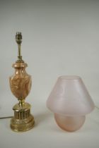 A vintage lilac glass mushroom lamp with etched leaf decoration, and a turned stone and brass