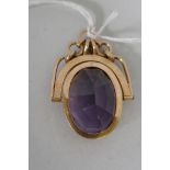 A 14ct gold fob watch with inset gemstone (topaz?), 3.5cm long, 7.7g