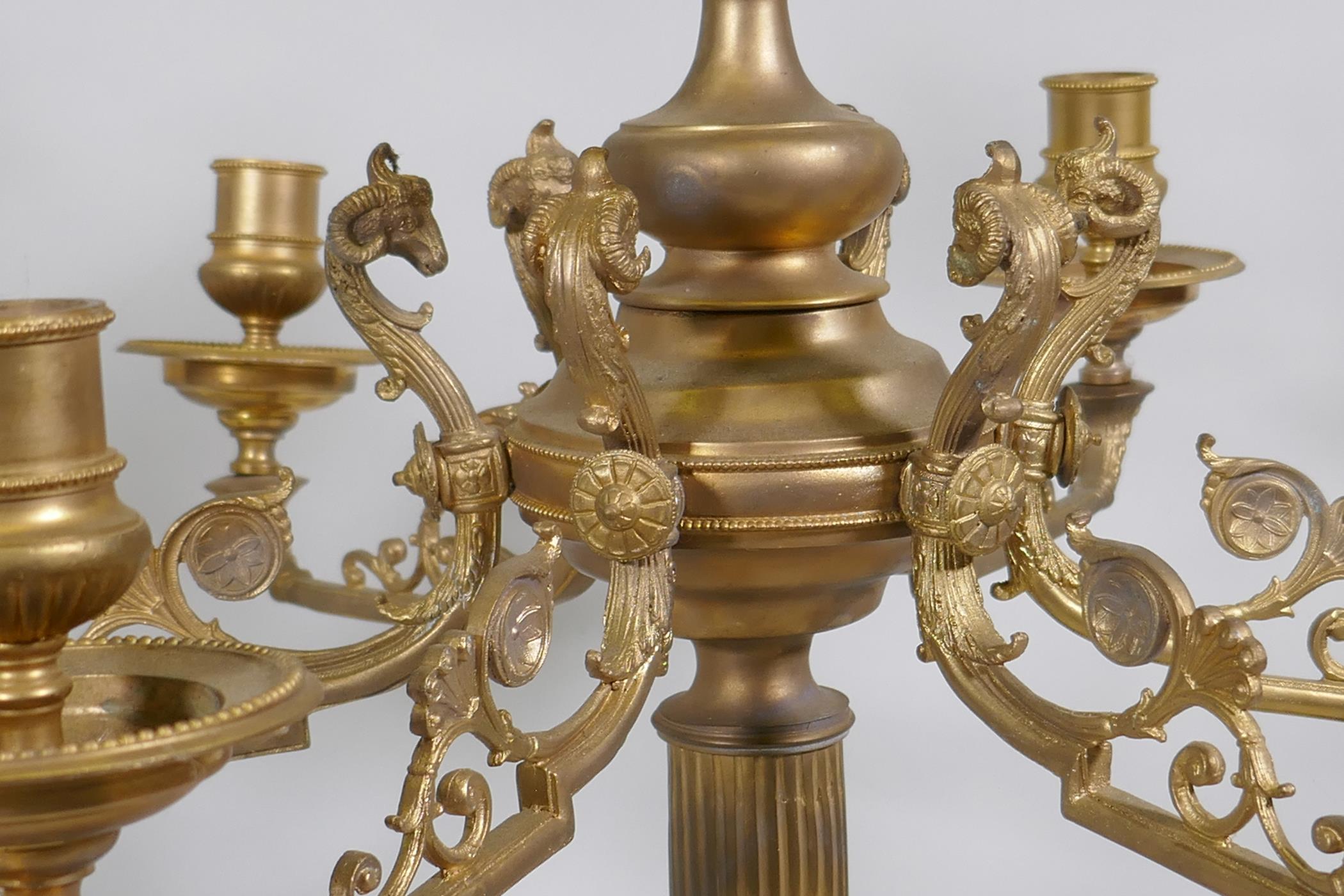 A pair of ormolu brass nine branch candelabra with ram's mask decoration, raised on fluted columns - Image 3 of 4