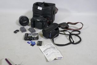 A Canon EOS 40D DLSR camera with EFS 17-85mm lens, batteries and case, and a Panasonic Lumix DMC-TX8