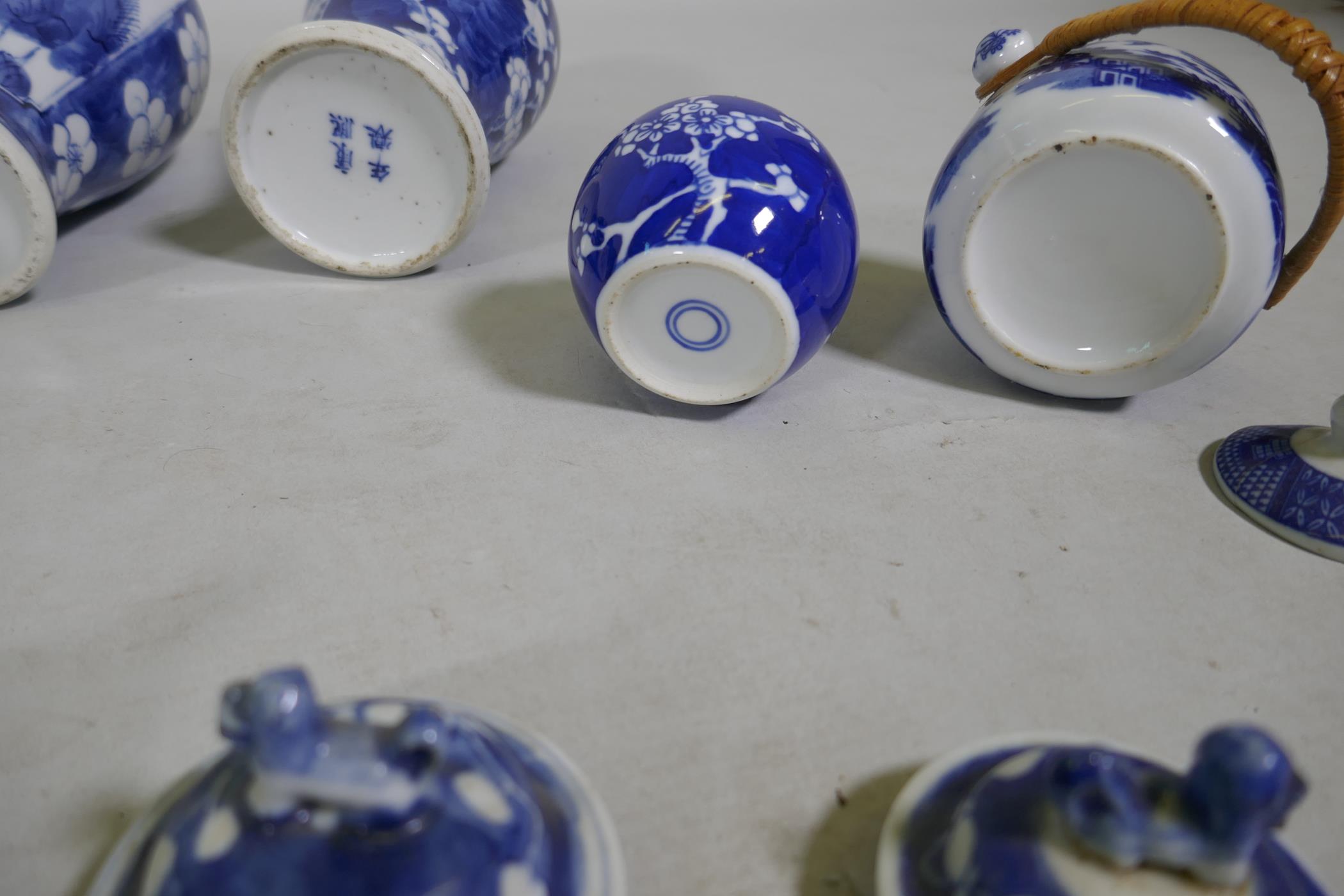 A collection of C19th Chinese blue and white vases with prunus on cracked ice decoration, mismatched - Image 4 of 6