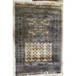 A hand woven wool Middle Eastern prayer rug, signed, 60 x 90cm, and another smaller