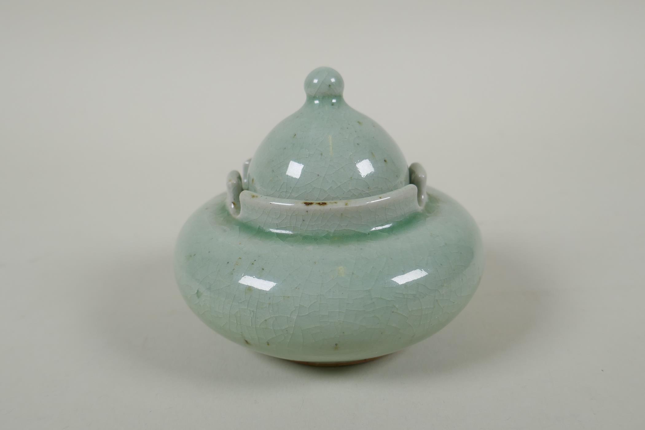 A Chinese celadon crackle glazed porcelain censer and cover, 11cm diameter - Image 4 of 4