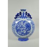 A Chinese blue and white porcelain two handled moon flask, decorated with dragon, phoenix and
