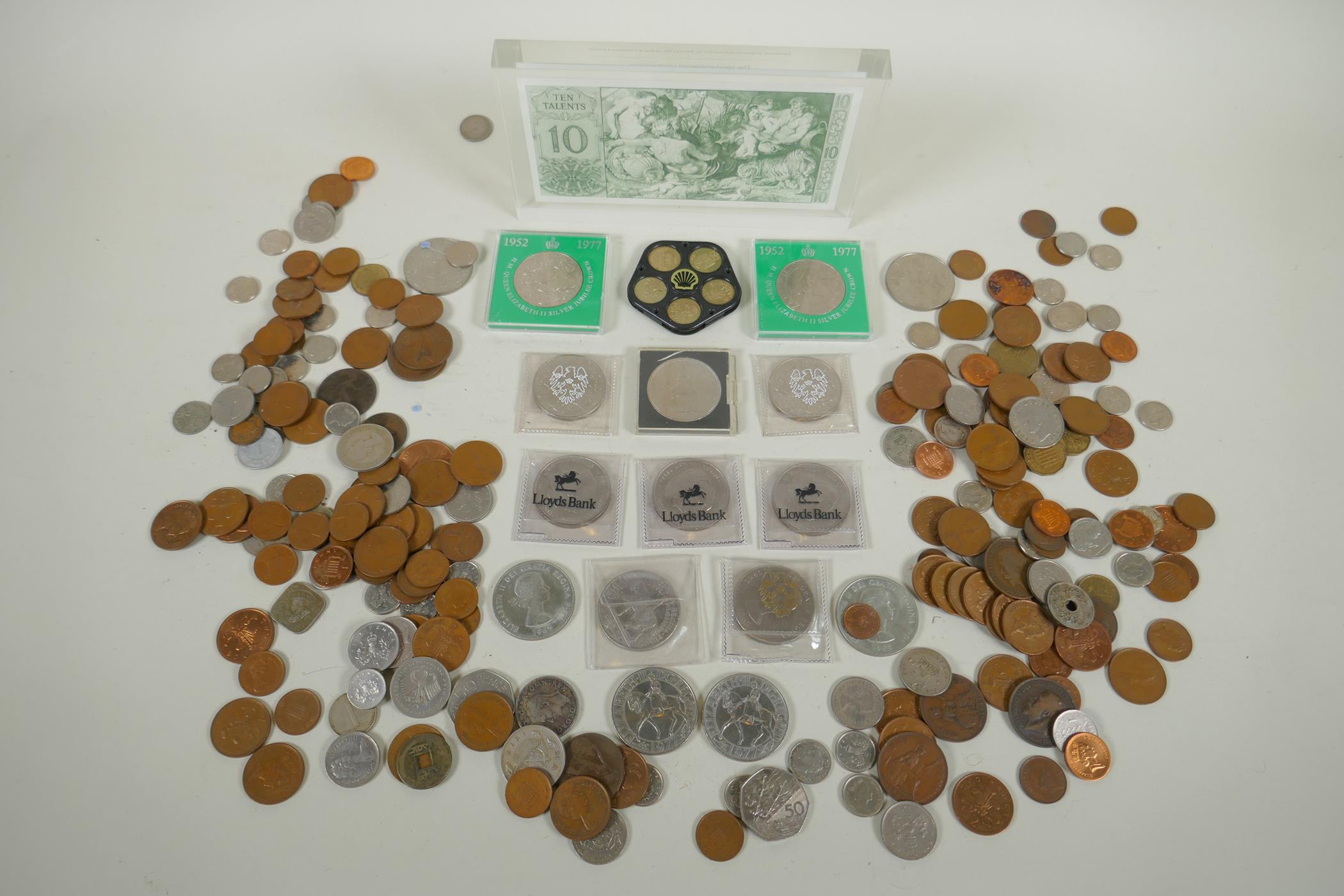 A quantity of assorted coinage, mostly British, and a ten Talents framed note