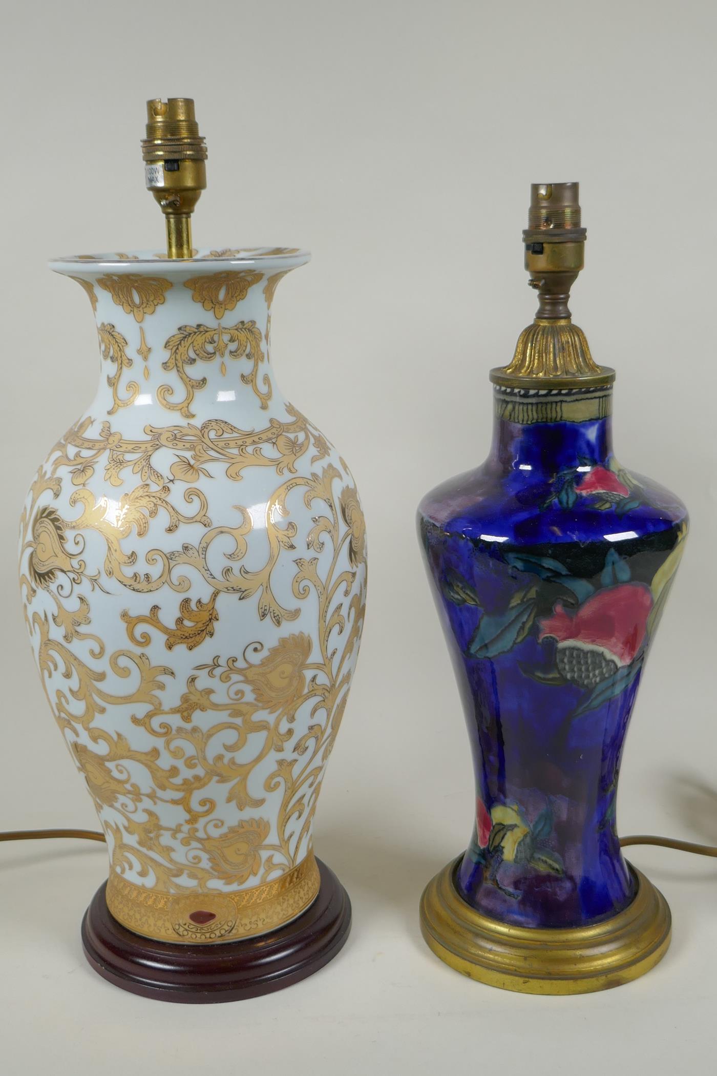 A Rubens ware pomegranate vase converted to a table lamp with brass mounts, together with a gilt