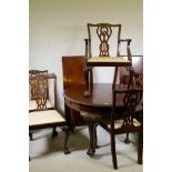A C19th Chippendale style mahogany wind-out dining table with gadrooned edge and two leaves,