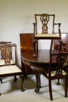 A C19th Chippendale style mahogany wind-out dining table with gadrooned edge and two leaves,