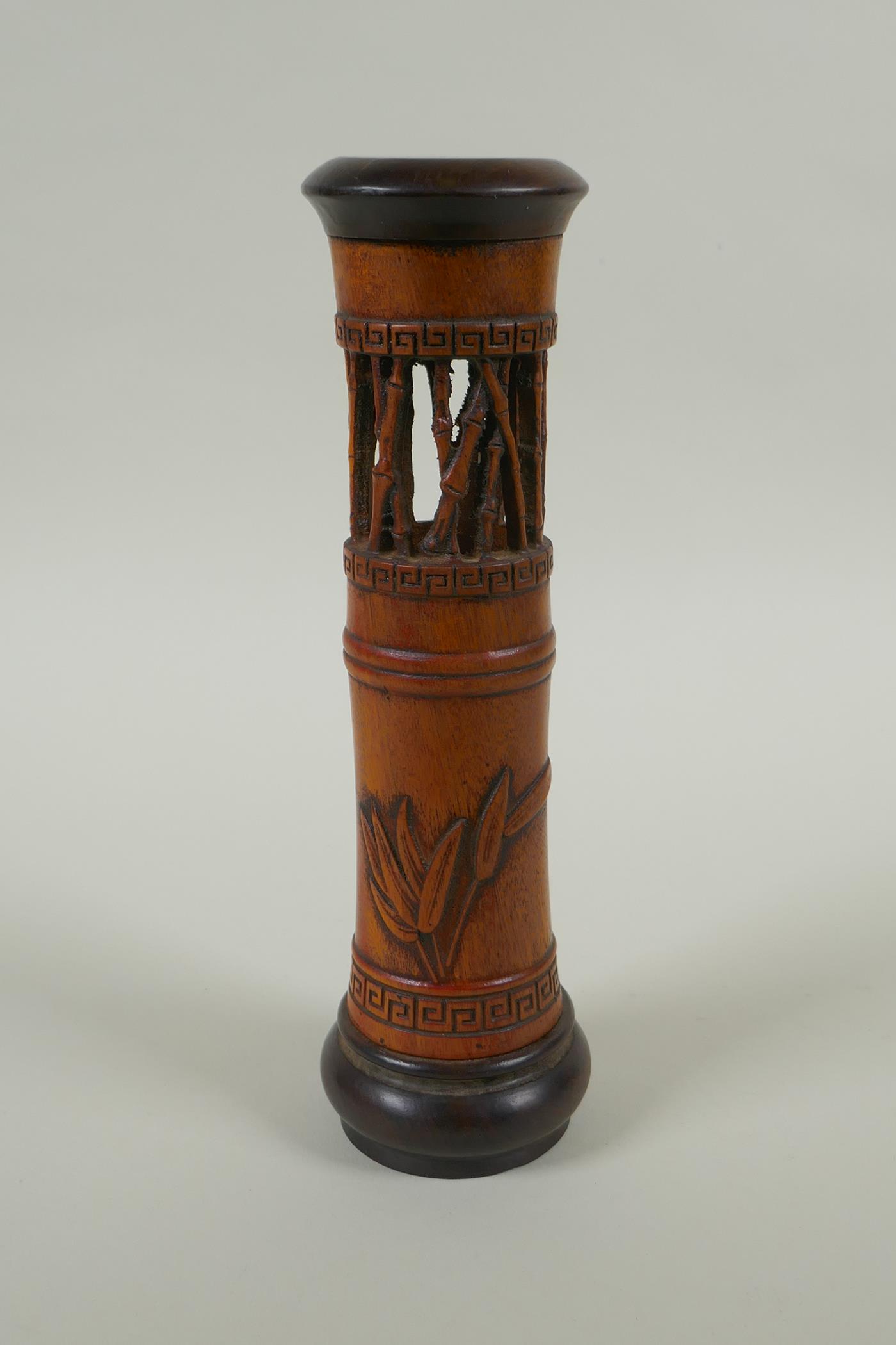 A Chinese carved bamboo incense burner with bamboo decoration, 25cm high