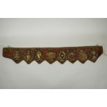 A Tibetan silk and linen belt with bronze mounts depicting the eight Buddhist treasures, 72cm long