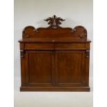 A Victorian mahogany chiffonier, the back with carved crest, the base with two frieze drawers over