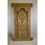 Architectural Salvage, an Oriental carved, painted and parcel gilt set of doors and frame, with