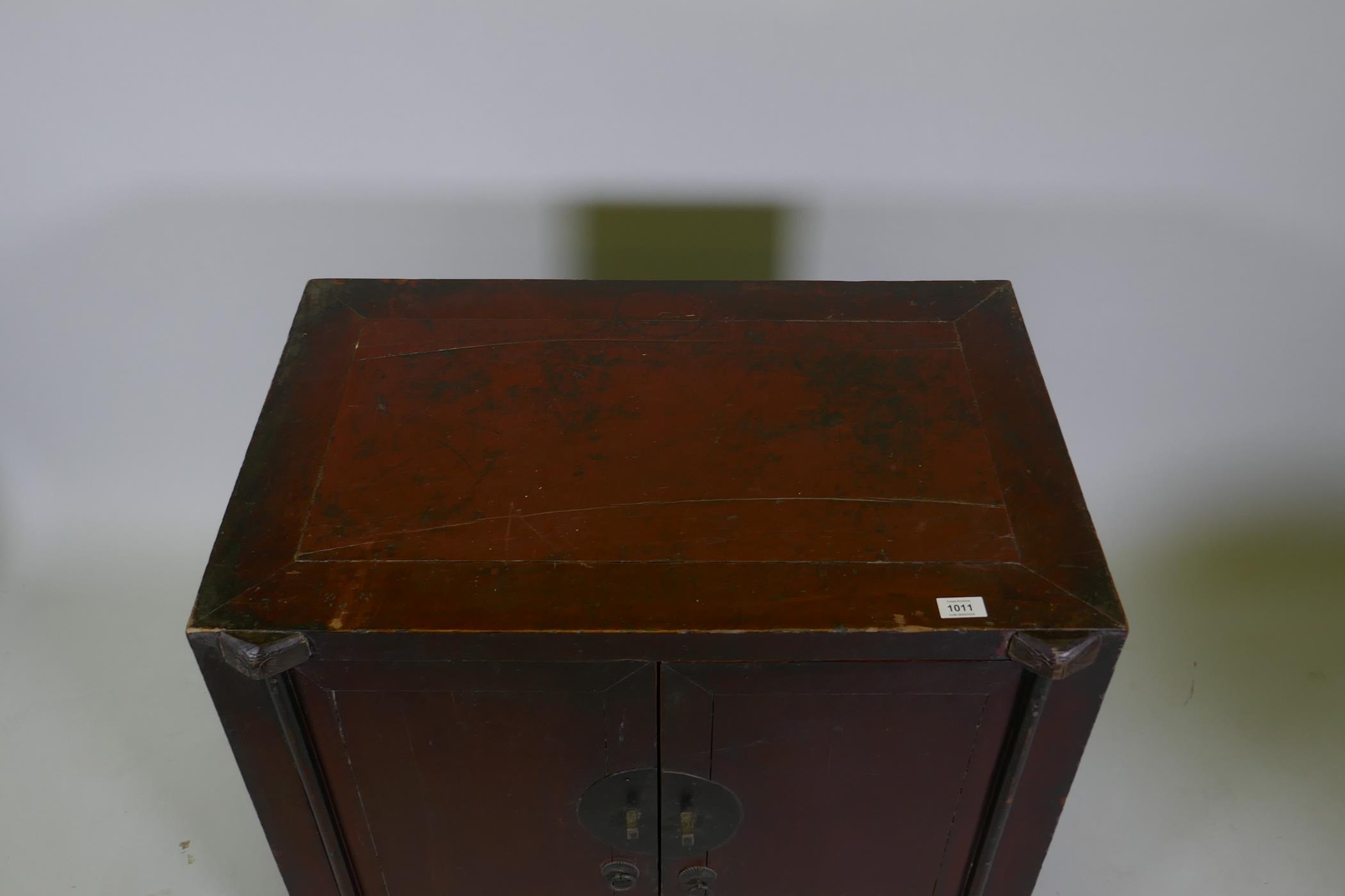 An antique Chinese red lacquered side cabinet with two doors, 78 x 50cm, 78cm high - Image 2 of 4