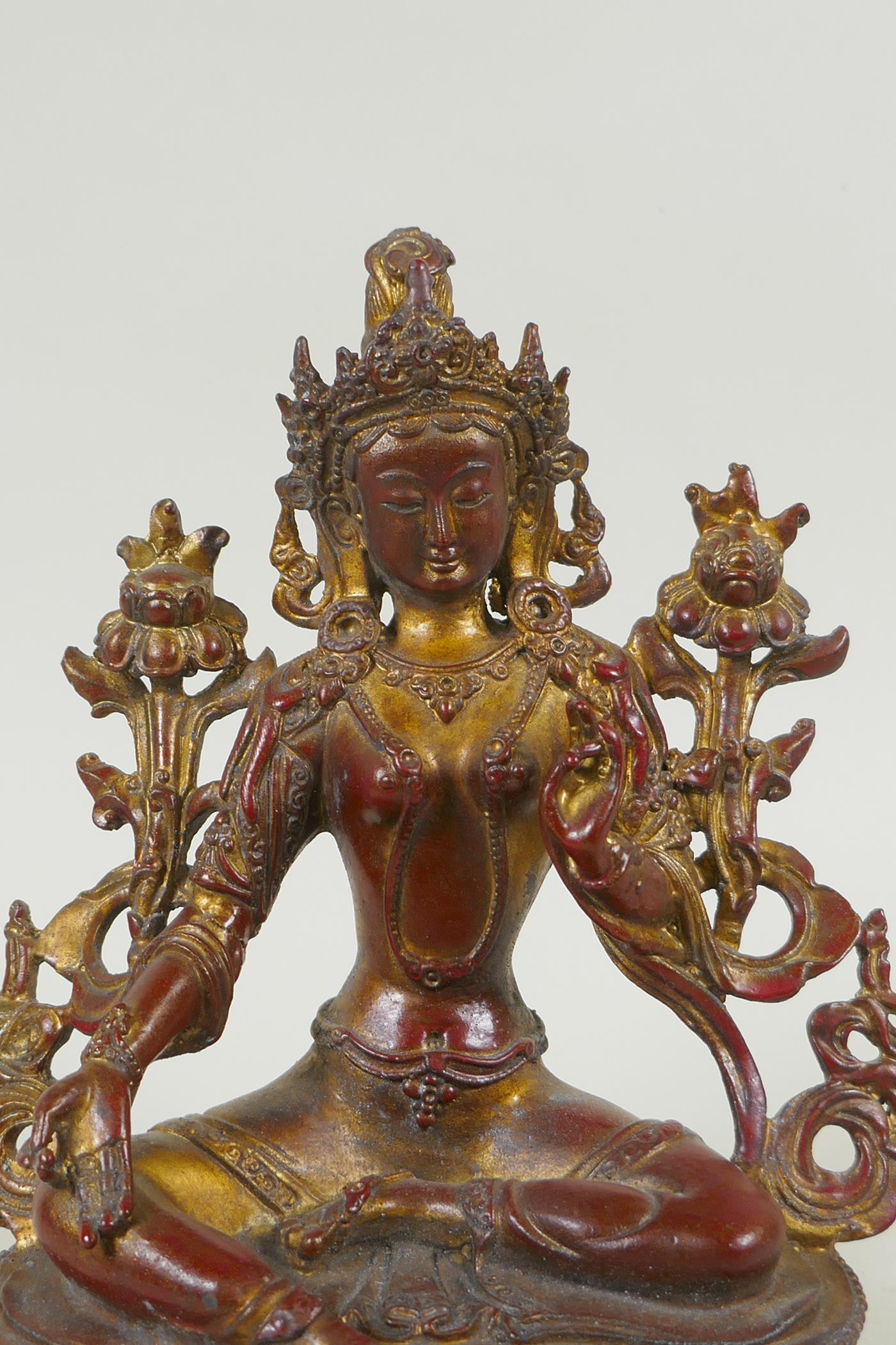 A Tibetan bronze figure of white tara with gilt and copper patina, 20cm high - Image 2 of 4
