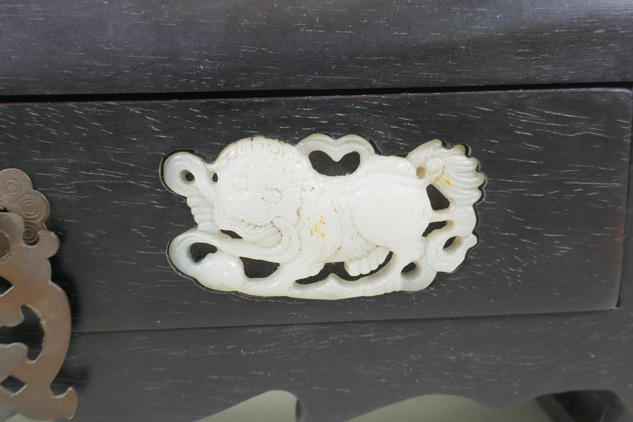 A Chinese hardwood box with secret locked drawer, set with carved jade lions, 26 x 9cm - Image 3 of 4