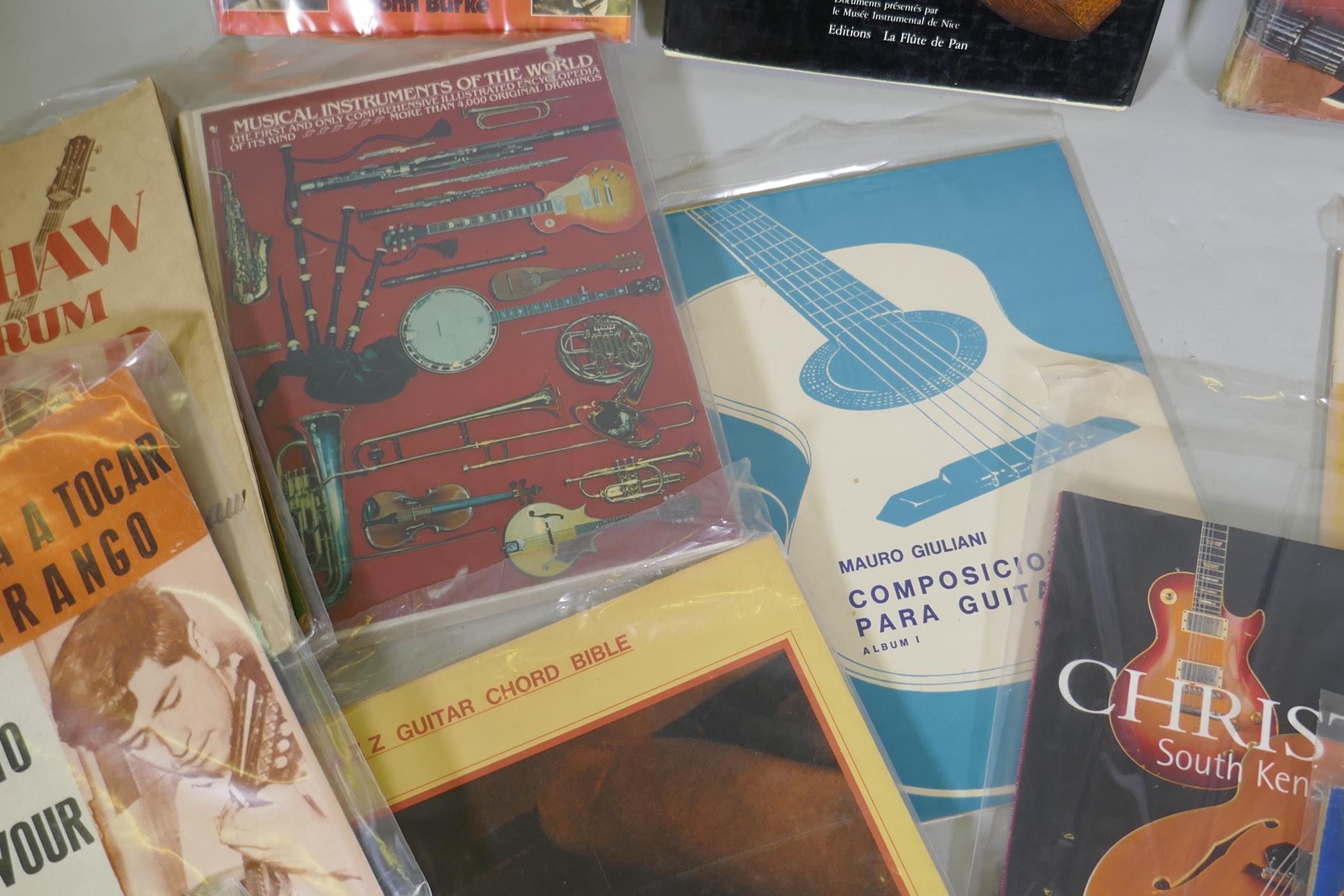 A collection of books, musical instruments, folk and African, guitars and instruction manuals - Image 4 of 5
