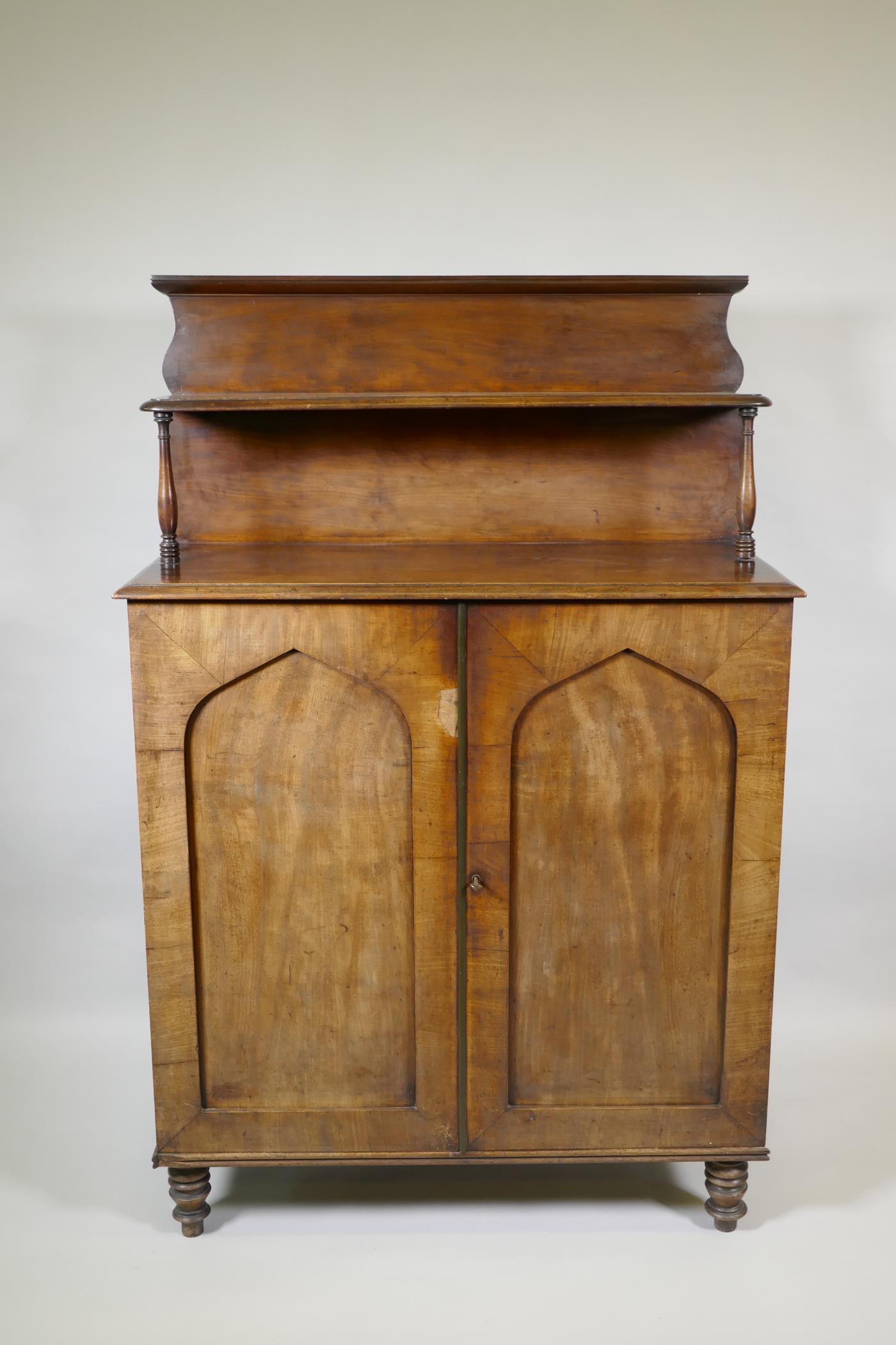 A C19th Regency country house mahogany chiffonier with arch panel doors and turned feet, 90 x