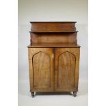 A C19th Regency country house mahogany chiffonier with arch panel doors and turned feet, 90 x