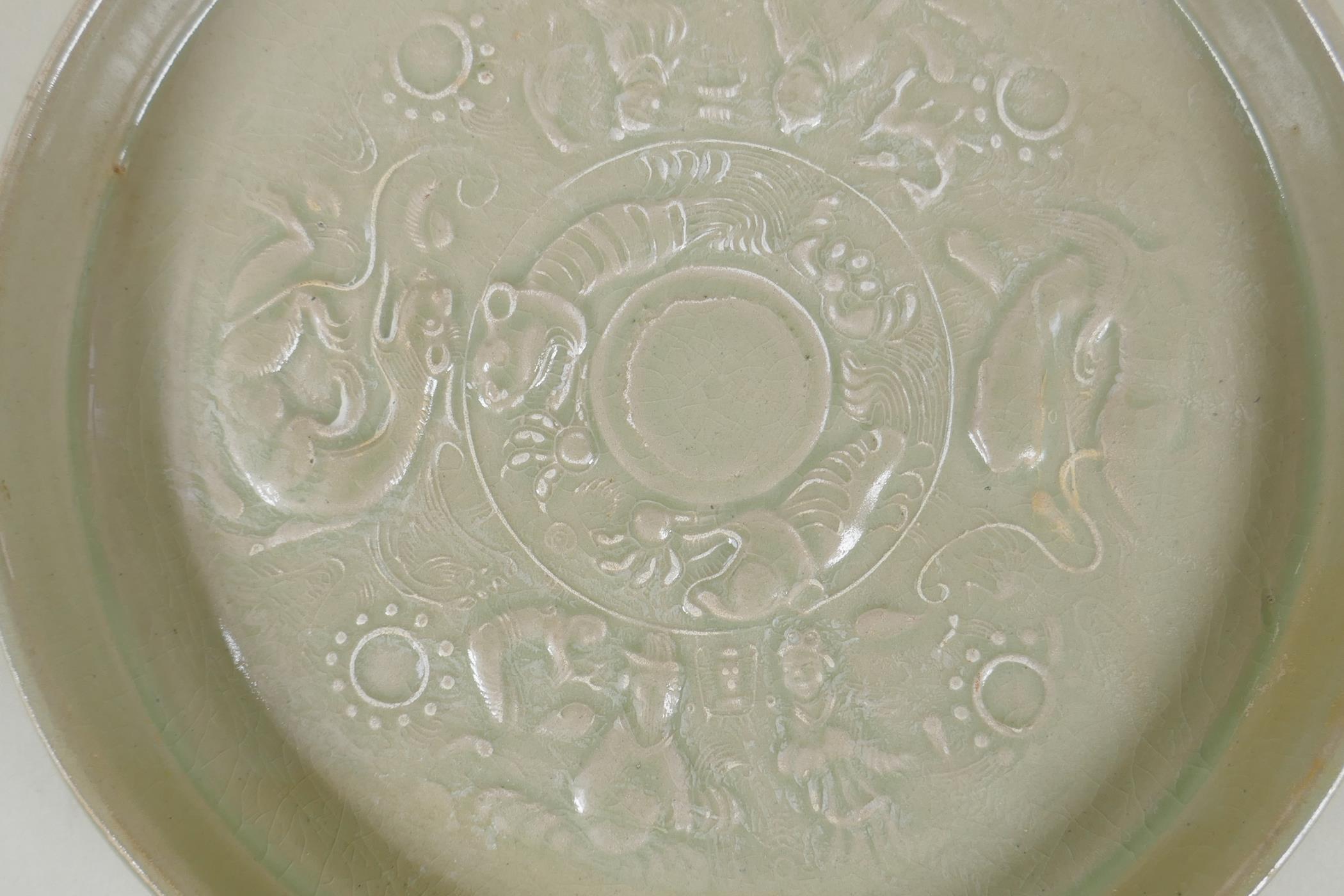 A Chinese celadon glazed porcelain shallow dish, with underglaze decoration of figures, dragons - Image 2 of 4