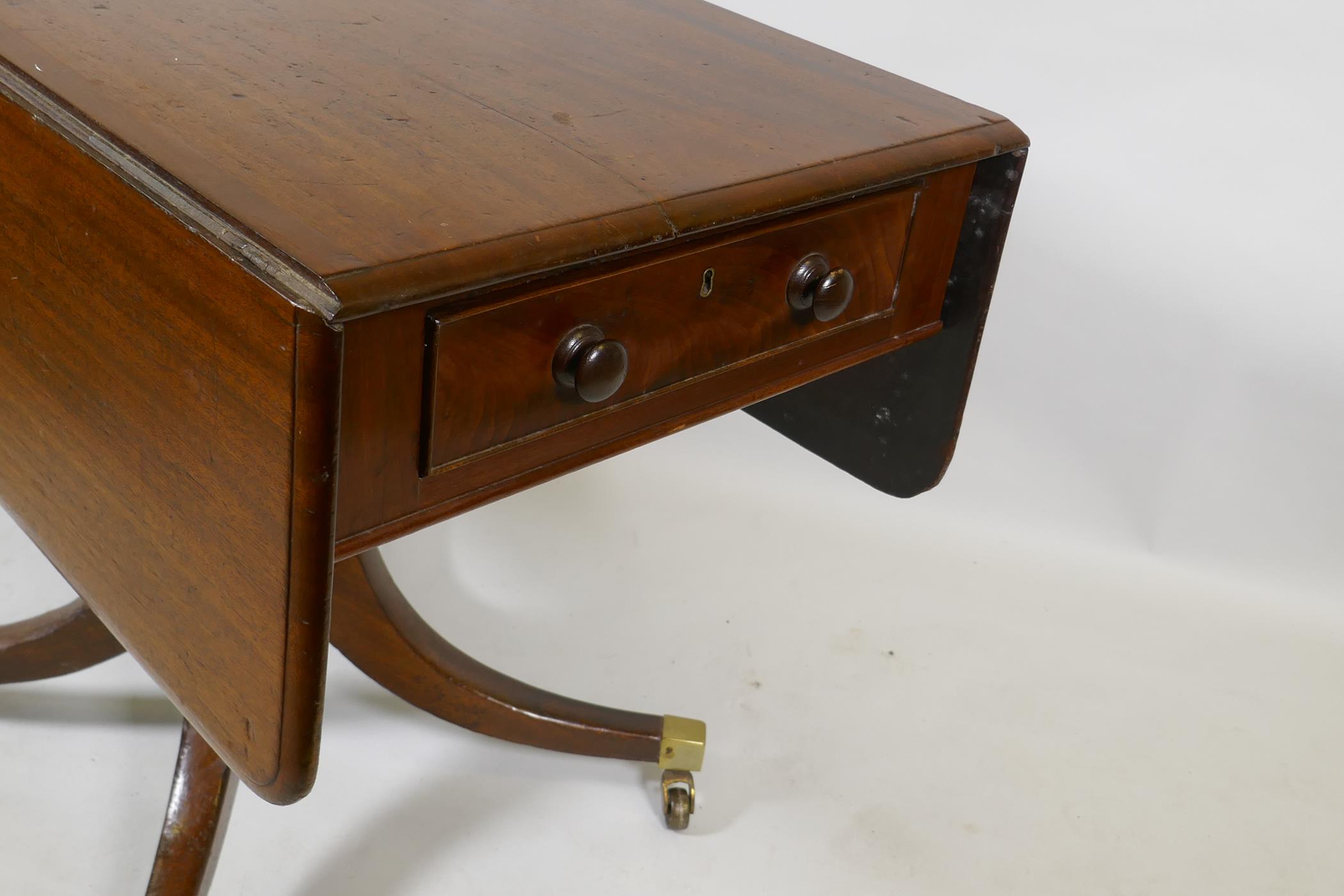 A Georgian mahogany pembroke table with one true and one false drawer, raised on a turned column and - Image 3 of 4