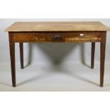 An early C19th pine scullery table with single drawer and scrubbed top, raised on tapering supports,