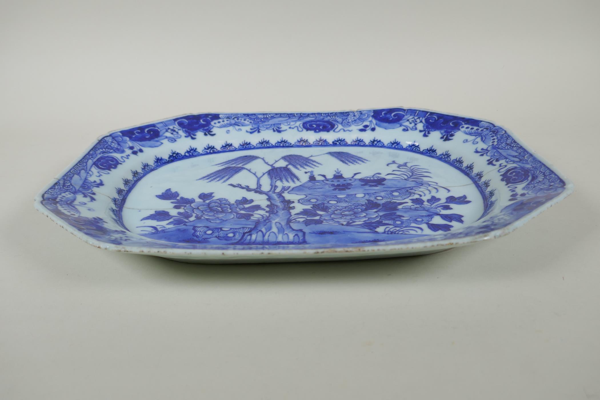 A C19th Chinese blue and white porcelain export ware dish, with historic pinned repairs, 36 x 27cm - Image 2 of 3