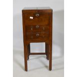 A Georgian mahogany gentleman's washstand, the fold out top with fitted interior and turned wood